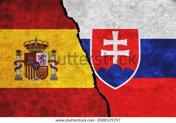 Spain and Slovakia painted flags on a wall with\
a crack. Spain and Slovakia conflict. Slovakia and Spain flags\
together. Spain vs\
Slovakia
