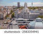 Spain. Sunny summer day over the rooftops of Madrid and the Cybele Palace