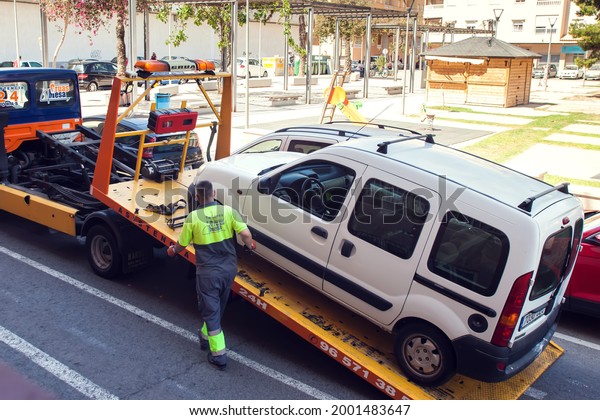 Spain, Torrevieja, 25 of\
June 2021, Tow track pick up the car for transportation to the\
service.