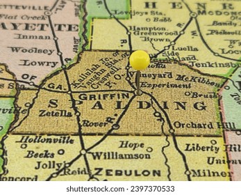 Spalding County, Georgia marked by a yellow tack on a colorful vintage map. The county seat is located in the city of Griffin, GA.
