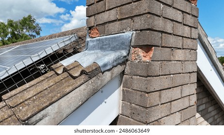 Spalling bricks on a chimney of semi detached house