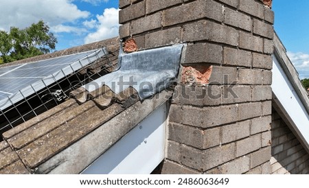 Spalling bricks on a chimney of semi detached house