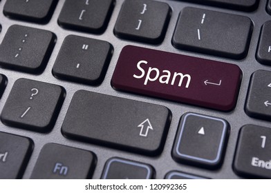 spam email concepts, with message on enter key of computer keyboard.