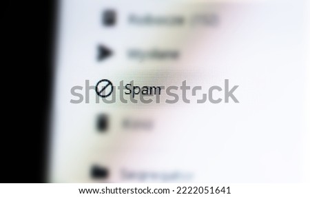 Spam messages folder in a generic email client web app, unwanted mail ads spam e-mail AI filtering, message filters, phishing mitigation abstract concept, nobody. Desktop PC, computer monitor, screen