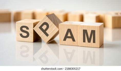 SPAM Text Written On Wood Block On Gray Table For Your Desing