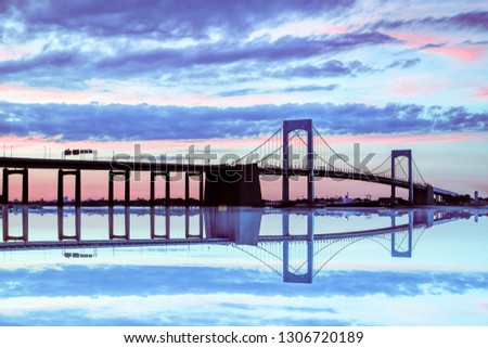 Span of the Throgs Neck Bridge in New York City colorful sky at dusk