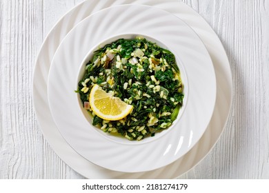 Spanakorizo, Greek Spinach And Rice Pilaf With Lemon, Dill, Spring Onion In White Bowl On White Textured Wooden Table, Horizontal View From Above, Flat Lay, Close-up, Macro