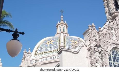 Spanish Colonial Revival Architecture In Balboa Park, San Diego, California USA. Historic Building, Classic Baroque Or Rococo Romance Style. Bell Tower Or Belfry Relief Decor And Mosaic Dome Or Cupola