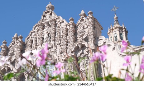 Spanish Colonial Revival Architecture In Balboa Park, San Diego, California USA. Historic Building, Classic Baroque Or Rococo Romance Style. Bell Tower Relief Decor And Mosaic Dome Or Cupola. Flowers.