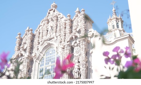 Spanish Colonial Revival Architecture In Balboa Park, San Diego, California USA. Historic Building, Classic Baroque Or Rococo Romance Style. Bell Tower Relief Decor And Mosaic Dome Or Cupola. Flowers.