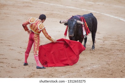 Spanish corrida in Madrid. The third stage of the bullfight, tercio de muerte, is when a matador using a muleta of wearing the bull down for the kill and a sword, or estoque, to murder him.