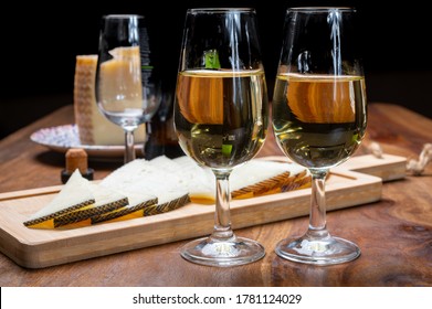 Spanish Fino Dry Sherry Wine From Andalusia And Pieces Of Different Sheep Hard Manchego Cheeses Made In La Mancha, Spain. Wine And Cheese Pairing