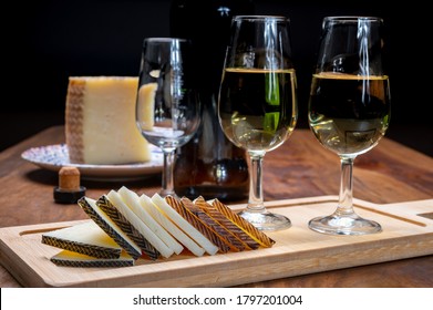 Spanish Fino Dry Sherry Wine From Andalusia And Pieces Of Different Sheep Hard Manchego Cheeses Made In La Mancha, Spain. Wine And Cheese Pairing