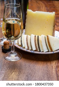 Spanish Fino Dry Sherry Wine From Andalusia And Pieces Of Different Sheep Hard Manchego Cheeses Made In La Mancha, Spain. Wine And Cheese Pairing