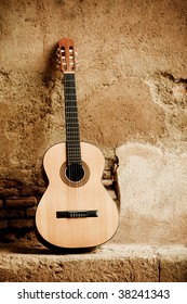 Spanish Guitar On Old Wall