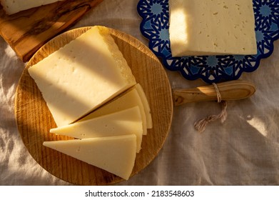 Spanish hard manchego, cow, sheep and goat cheese served outdoor in morning sunlights close up - Powered by Shutterstock