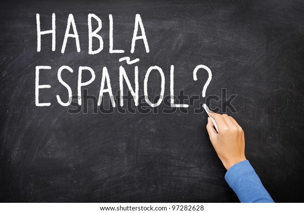 Spanish language learning concept image. Teacher\
or student writing \