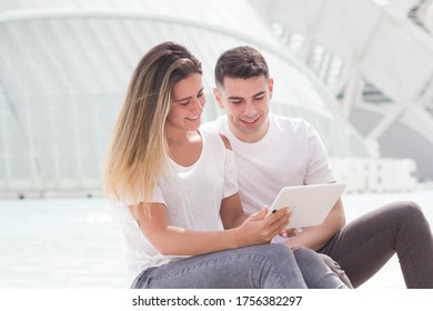 Spanish Loving Couple Making A Video Call. Having Fun With A Tablet Computer