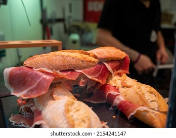 Spanish Low Cost Street Food, Bocadillo Bread Sandwich Dry-cured Ham Jamon Serrano Close Up