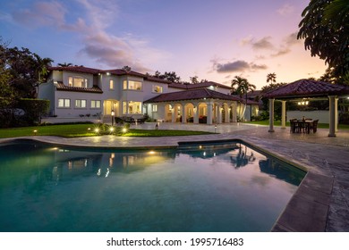 Spanish Mansion, Sky At Dusk And A Great Pool For Swimming. Miami, Florida.