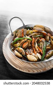 Spanish Mediterranean Clam And Vegetable Stew In Pot At Barcelona Restaurant