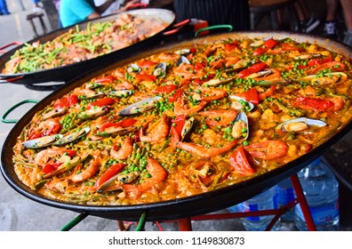 Spanish paella prepared in the street restaurant.