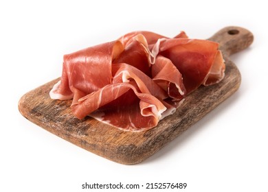 Spanish serrano ham on cutting board isolated on white background - Shutterstock ID 2152576489