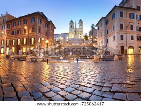 Spanish Steps and a boat-shaped fountain on Piazza di Spagna in Rome, Italy. Early morning panoramic shot after rain.