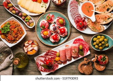 spanish tapas and sangria on wooden table, top view - Shutterstock ID 519793093