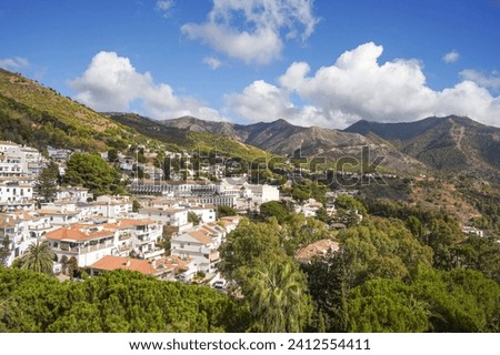 The spanish white washed village of Mijas pueblo with Sierra de Mijas  behind, Andalusia, Malaga province, Spain