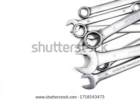 Spanner Set Isolated. Silver coloured spanners lying side by side in white background.