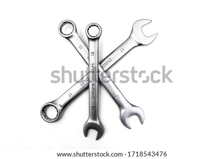 Spanner Set Isolated. Silver coloured spanners lying side by side in white background.