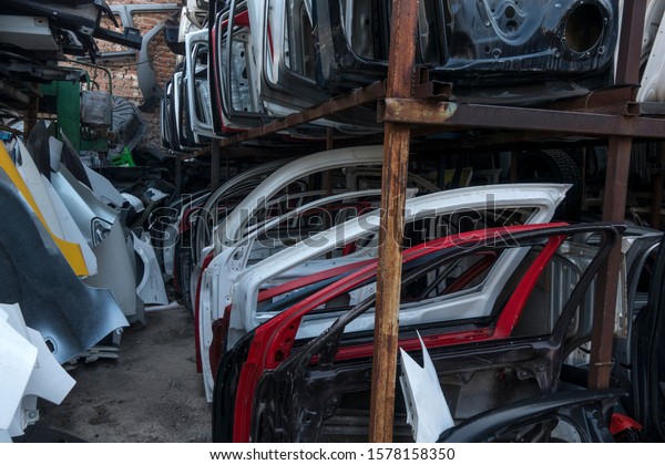Spare Car Parts Lined Side By Side\
Scrap Car Parts Junkyard Wonderful Interesting Different Varied\
Background Displays Industrial Industrial buying\
now.
