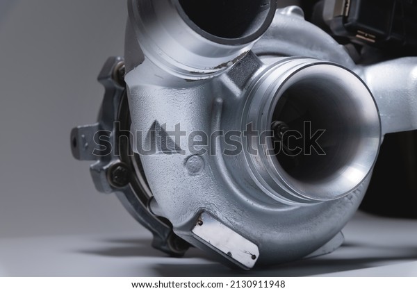 Spare part New car turbine on a white\
background. close-up. Car parts copy\
space