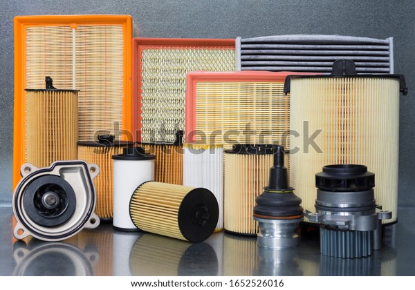 Spare parts and accessories for the\
car. Filters for a car close-up on a steel\
background.