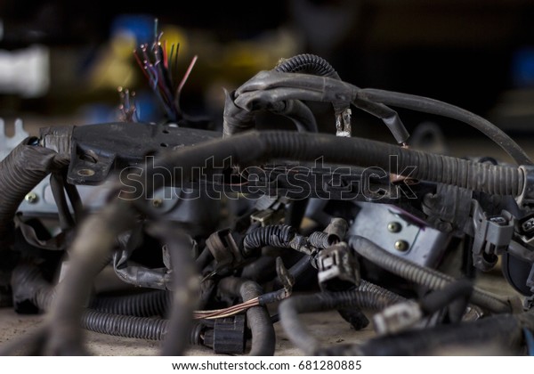 Spare parts in auto service. Wires and\
cables in corrugation.