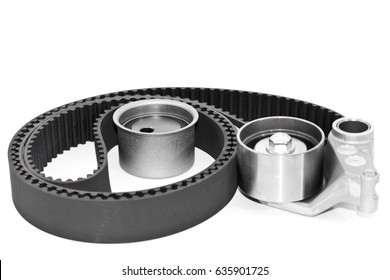 Spare parts for the ca r. Kit of timing belt with rollers on a light background.