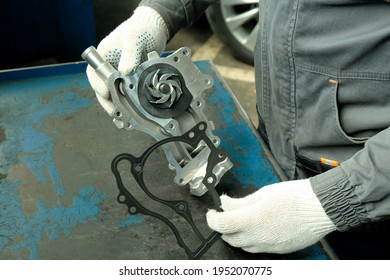 Spare Parts For The Car. Water Pump, Close-up. Control Of The Technical Condition Of The Part Before Replacement During Repair In The Service Center.