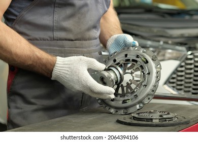 Spare parts for cars. Car clutch kit. The car mechanic monitors the technical condition of the drive disc, the driven disc and the exhaust bearing. - Shutterstock ID 2064394106
