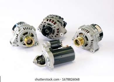 Spare Parts For Repairing And Restoring Electric Equipment Of A Passenger Car. Close-up Of Generators And Starter On A White Background, Top View.