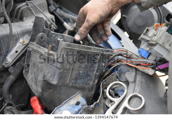 Spare parts and tools for the car. Car repair\
mechanic closeup.