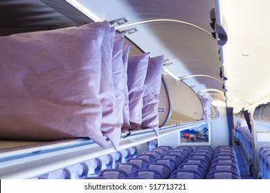 Spare Pillows In The Airplane Overhead Compartment, Selective Focus.