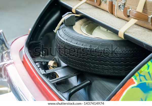 Spare wheel in storage bin
on a car