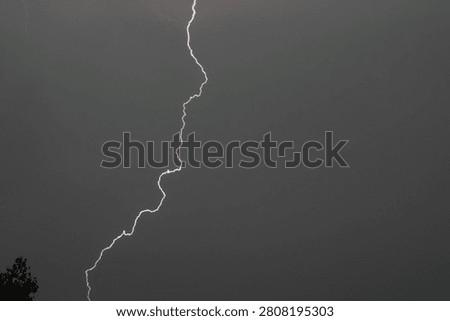 A spark discharge between a cloud and the ground. This natural phenomenon is also called lightning. It occurs when a cloud becomes electrified.