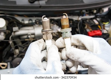 Spark plug replacement work - Shutterstock ID 342370934