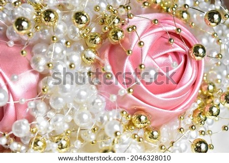 Sparkle twinkle glitter golden pearl string, jewelry handmade background, Vintage handmade cream silk ribbon roses