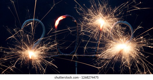 Sparkler isolated on a solid black background, 2019, happy newyear!