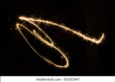 sparkler light trail in dark environment using slow shutter speed - Powered by Shutterstock