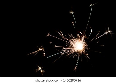 Sparkler On Black Background; Fire Sparks Particles On Black Background For Overlay Design; The Source Of Sparks Located On Right Bottom Corner