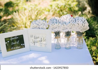 Sparkler Table Set Up At Wedding Ready For Guests To Set Off In The Evening